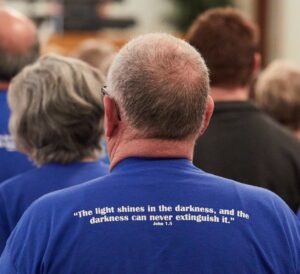 Verse for the Occasion: A light shines in the darkness, and the darkness can never extinguish it. I was trying to get the verse on the shirt.
